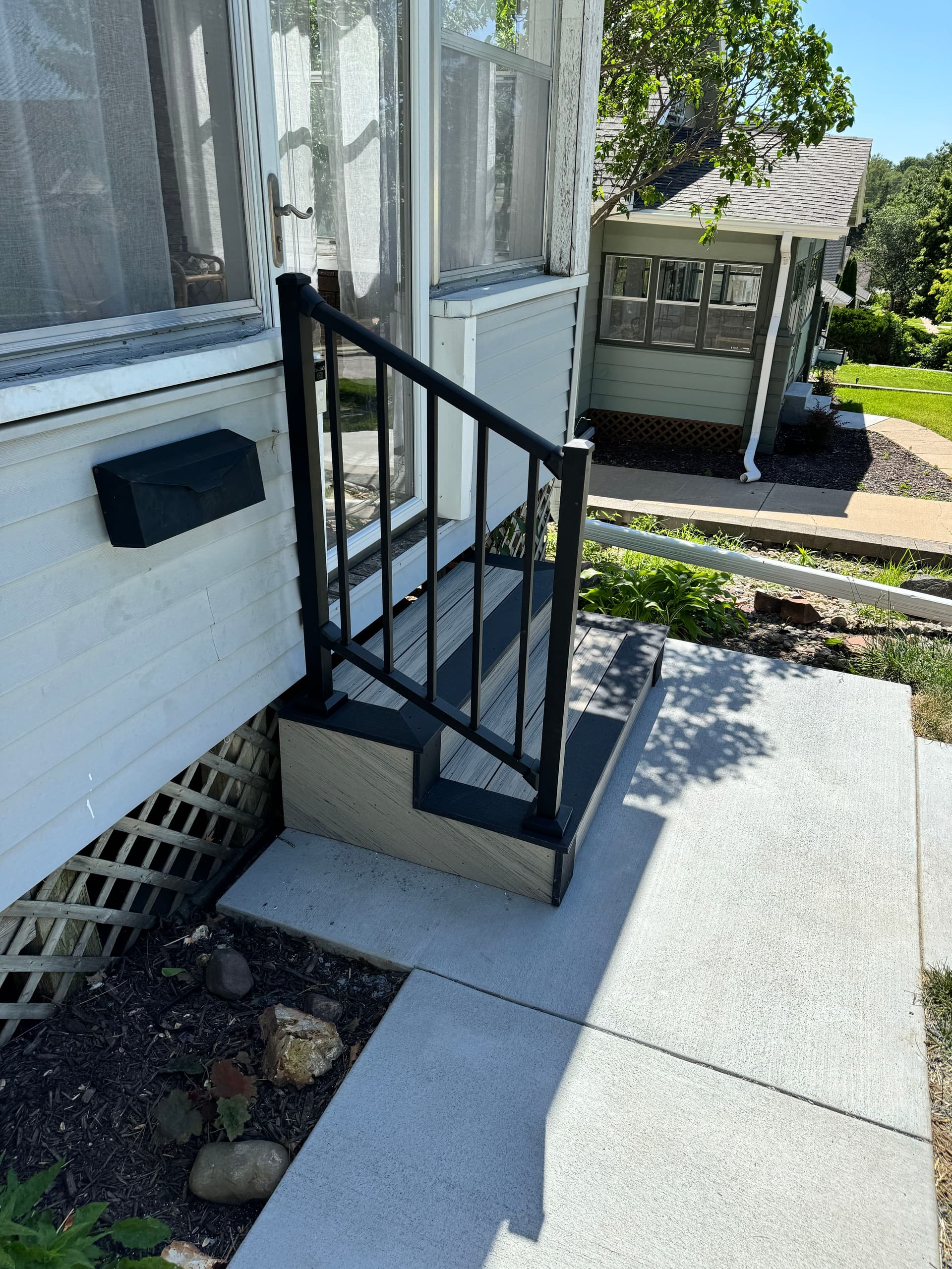 Composite Stair Build with Westbury Aluminum Railing on a Front Entry image