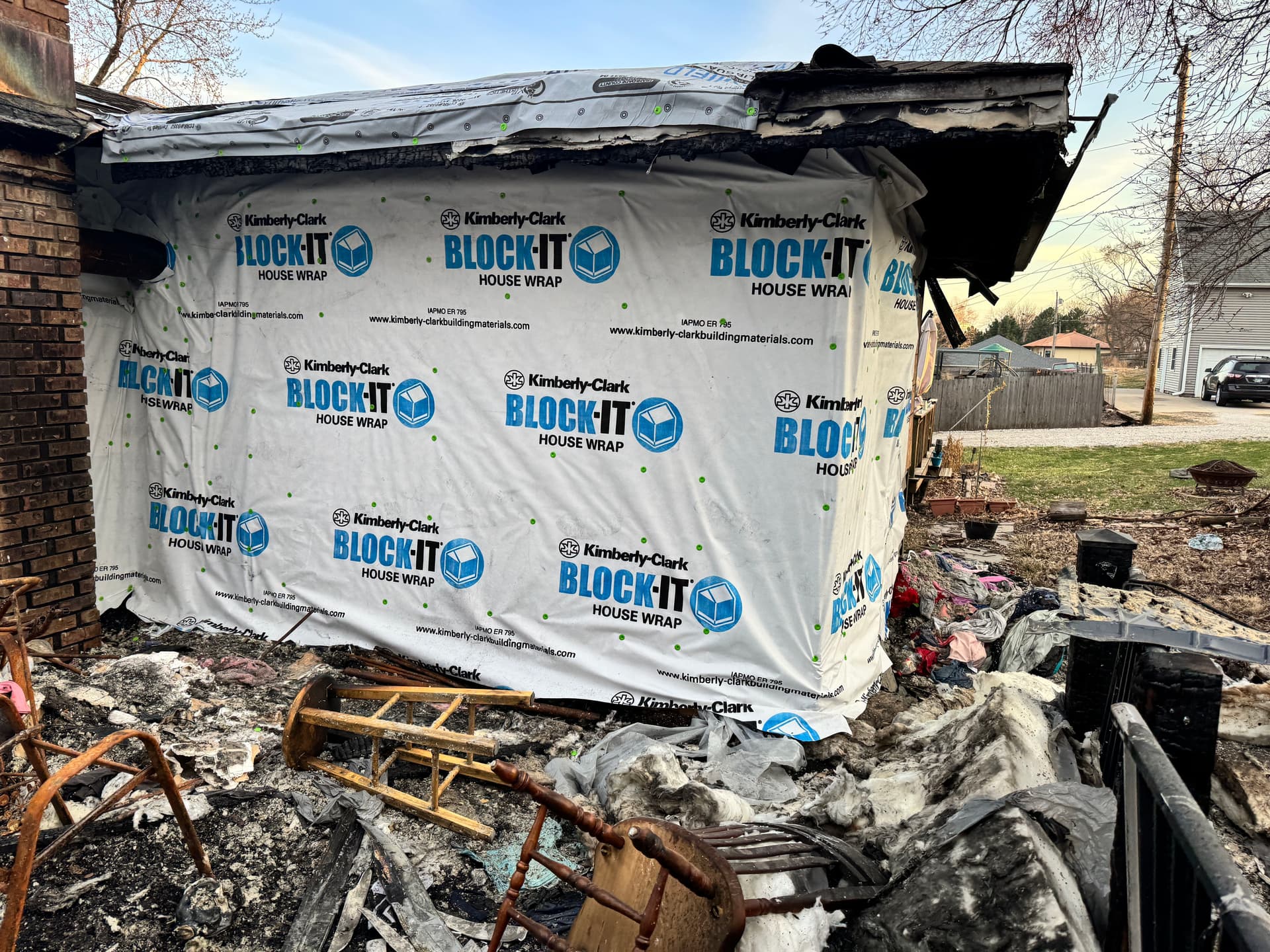 Emergency Board-Up After Severe House Fire Guts Back Deck and Framing